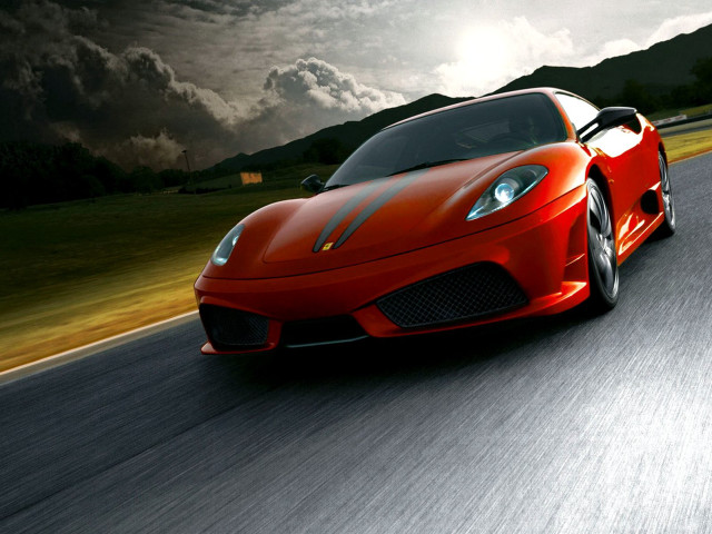 Red sports car driving cloudy free wallpaper for desktop - medium preview image