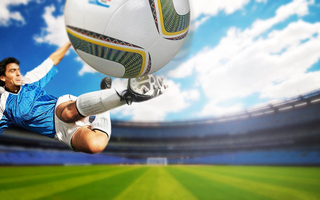 Man kicking soccer ball grass #2 free wallpaper for desktop - medium preview image