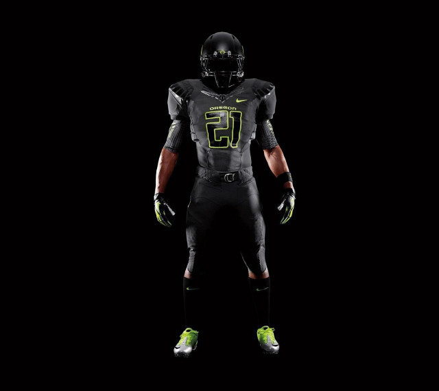 Football player black uniform green free wallpaper for tablet - medium preview image