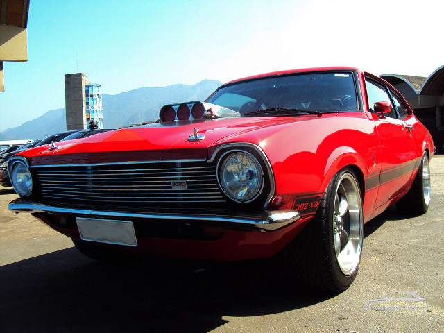 Red car parking lot mountain free wallpaper for desktop - medium preview image