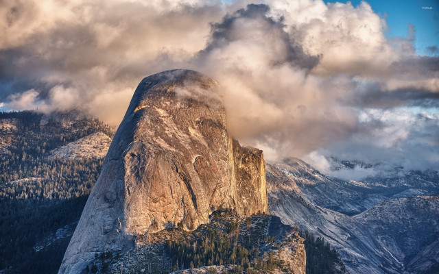 Tall mountain rock face clouds free wallpaper for desktop - medium preview image