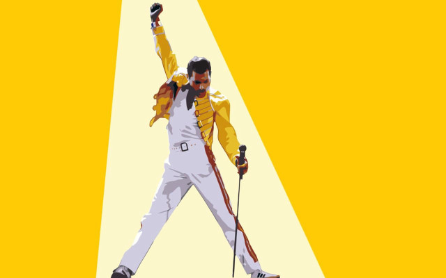 Man yellow jacket holding skis free wallpaper for desktop - medium preview image