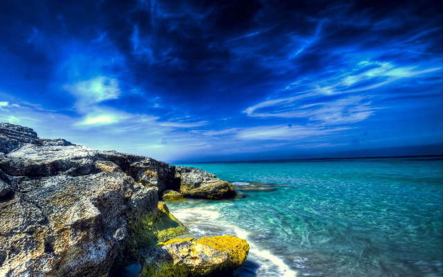 Rocky beach blue sky water free wallpaper for desktop - medium preview image