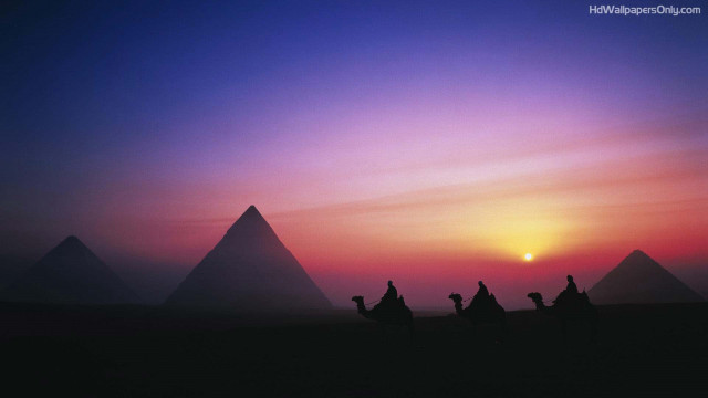 Camel riders desert sunset pyramids free wallpaper for desktop - medium preview image
