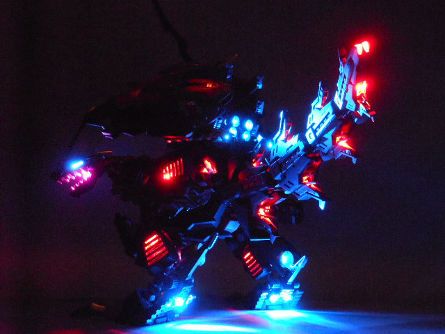 Toy robot lights dark background free wallpaper for desktop - medium preview image