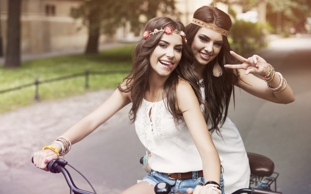 Girls bike peace sign smiling free wallpaper for desktop - medium preview image