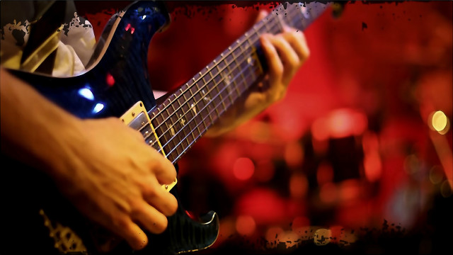 Guitarist red background blurry lights free wallpaper for desktop - medium preview image