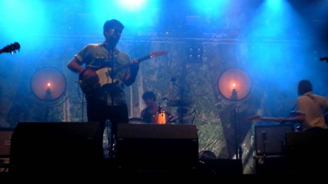 Man playing guitar stage blue free wallpaper for desktop - medium preview image