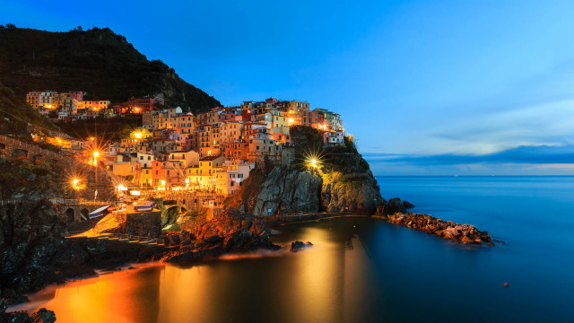 City cliff ocean night lights free wallpaper for desktop - medium preview image