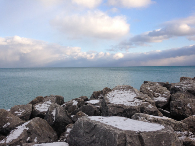 Rocky shore snowy rocks water free wallpaper for desktop - medium preview image