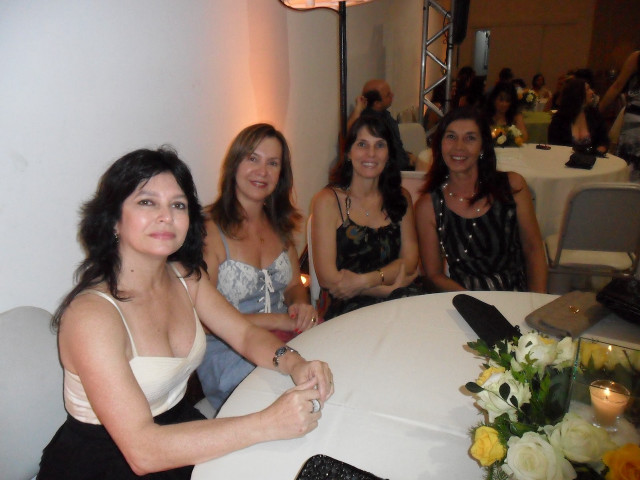 Women candles flowers table gathering free wallpaper for desktop - medium preview image