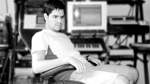 Man sitting chair computer desk free wallpaper for desktop - medium preview image