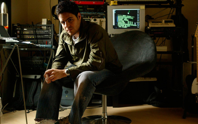 Man sitting chair computer guitar free wallpaper for desktop - medium preview image