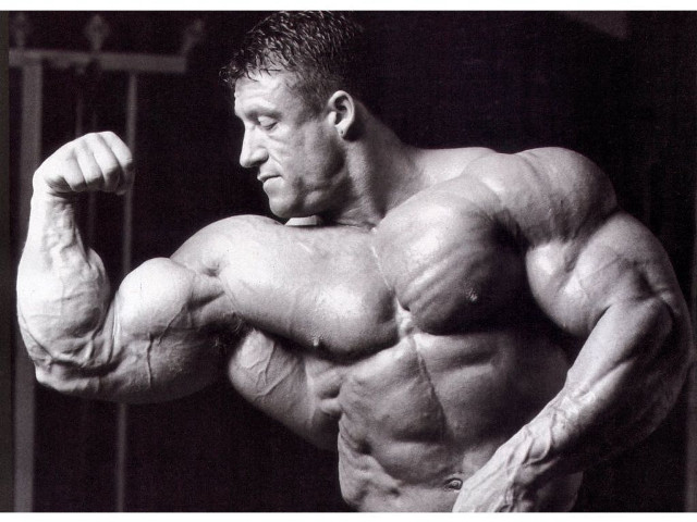 Man flexing muscles black white free wallpaper for desktop - medium preview image