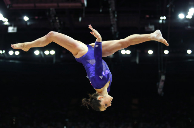Woman handstand gymnastics crowd athletic free wallpaper for desktop - medium preview image