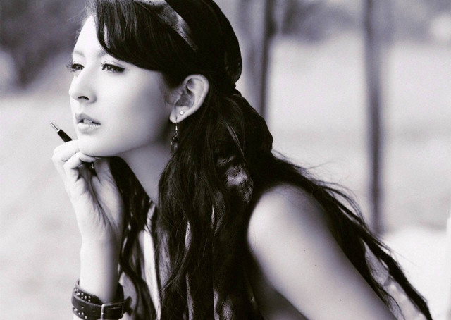 Woman long hair smoking cigarette free wallpaper for desktop - medium preview image