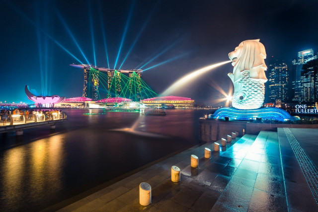 Mermaid statue city skyline night free wallpaper for desktop - medium preview image