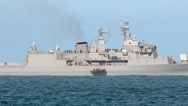 Large gray ship floating water free wallpaper for desktop - medium preview image