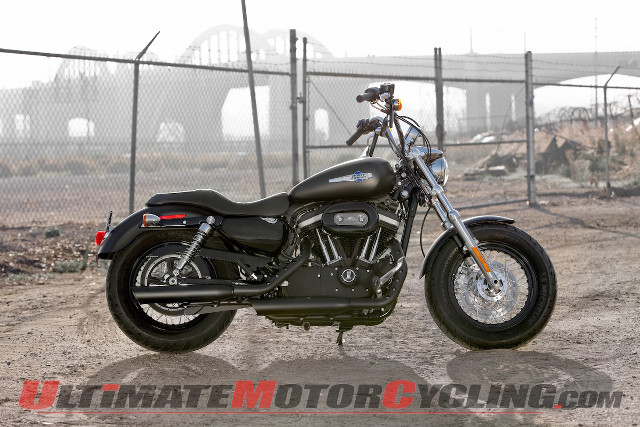 Motorcycle parked dirt lot fence free wallpaper for desktop - medium preview image