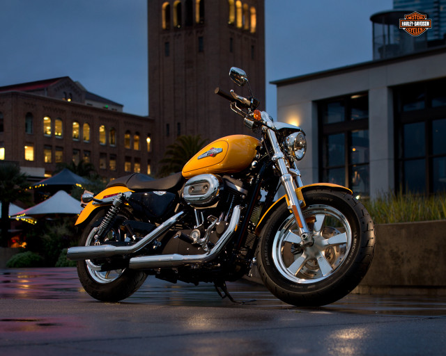 Yellow motorcycle parked building night free wallpaper for desktop - medium preview image