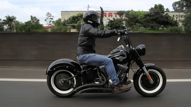 Man motorcycle street fence trees free wallpaper for desktop - medium preview image