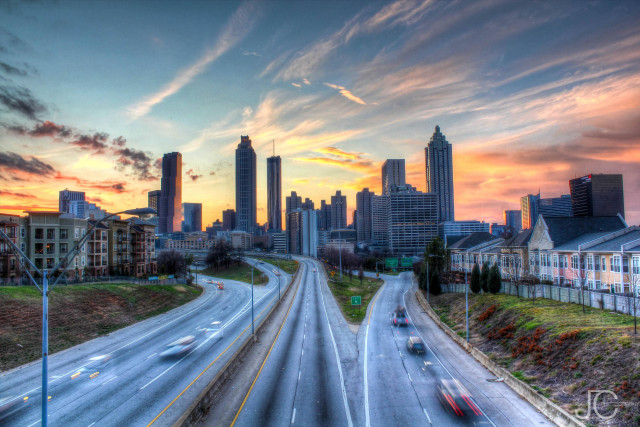 City skyline sunset highway cars free wallpaper for desktop - medium preview image