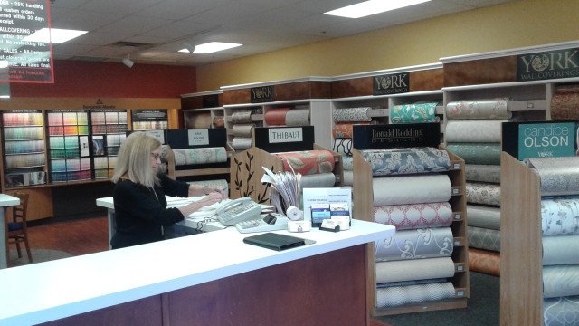 Woman sitting desk store fabrics free wallpaper for desktop - medium preview image