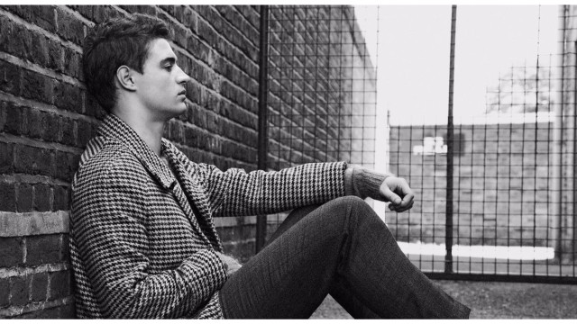 Man sitting brick wall fence free wallpaper for desktop - medium preview image