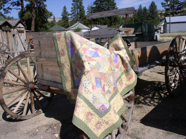 Quilted blanket draped wagon wooden free wallpaper for desktop - medium preview image