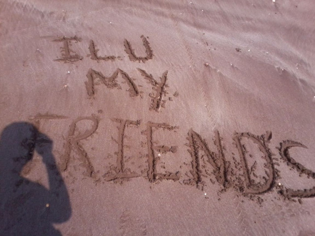 Person writing sand cellphone camera free wallpaper for desktop - medium preview image