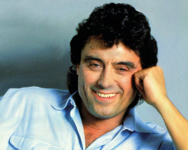 Smiling man blue shirt polka free wallpaper for desktop - medium preview image