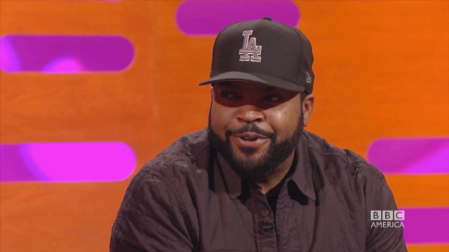 Man hat black shirt sitting free wallpaper for desktop - medium preview image