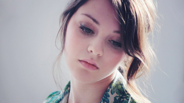 Woman flowered shirt necklace serious free wallpaper for desktop - medium preview image