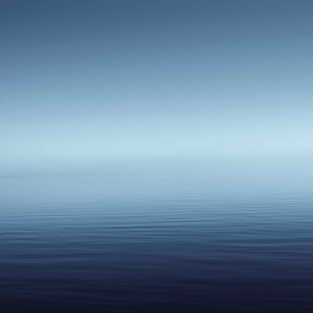 Lone boat calm ocean blue free wallpaper for tablet - medium preview image