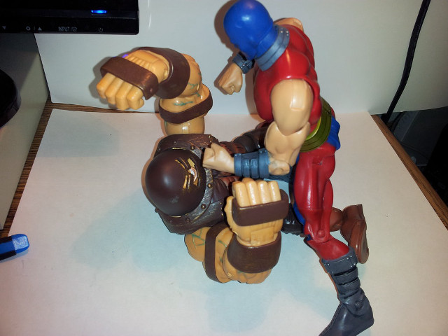 Toy figure held tabletop computer free wallpaper for desktop - medium preview image