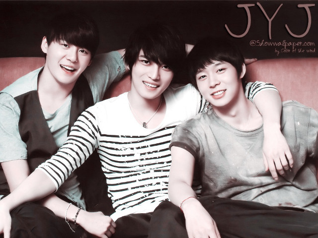 Three young men sitting couch free wallpaper for desktop - medium preview image