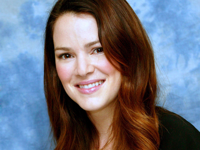 Woman red hair smiling blue free wallpaper for desktop - medium preview image