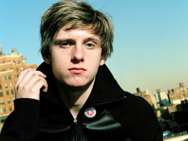 Man black jacket cityscape building free wallpaper for desktop - medium preview image