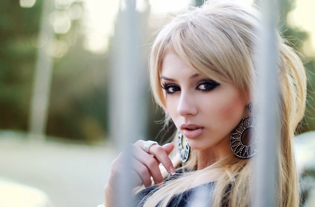 Woman long hair big earrings free wallpaper for desktop - medium preview image