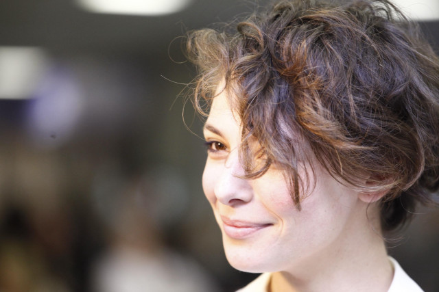 Messy haircut white shirt smiling free wallpaper for desktop - medium preview image