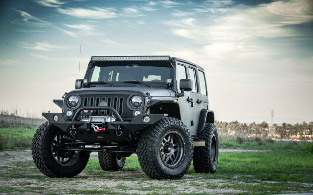 Black jeep parked field grass free wallpaper for desktop - medium preview image