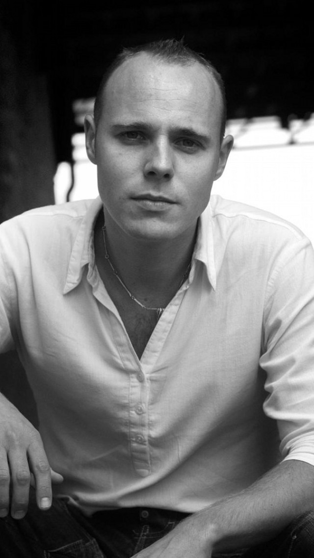 Man sitting hands on knees #2 free wallpaper for mobile - medium preview image