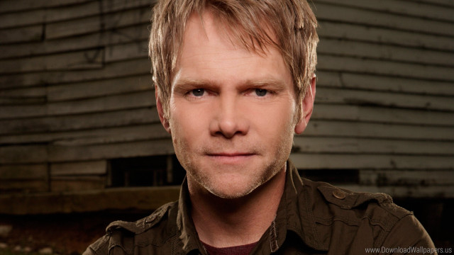 Blonde hair brown shirt serious free wallpaper for desktop - medium preview image