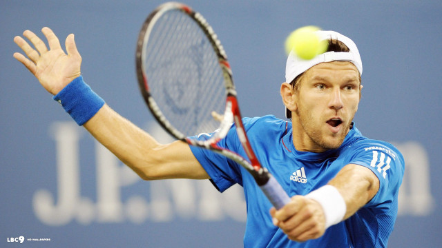 Man swinging tennis racket ball free wallpaper for desktop - medium preview image