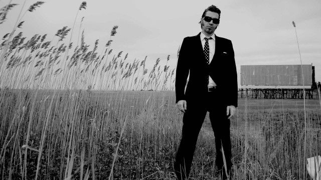 Man suit tie field grass free wallpaper for desktop - medium preview image