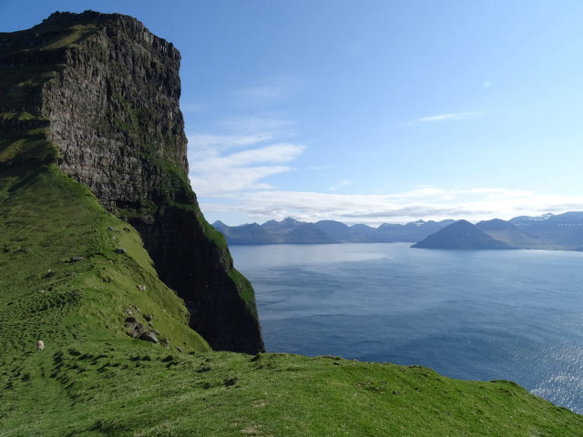 Grassy hill water mountains blue free wallpaper for desktop - medium preview image