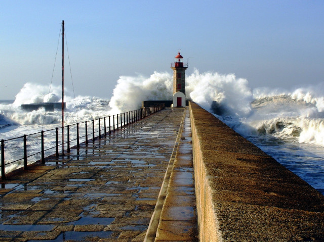 Lighthouse waves pier fence stormy free wallpaper for desktop - medium preview image