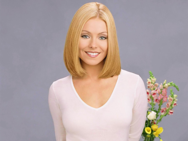 Blonde woman smiling flower vase free wallpaper for desktop - medium preview image