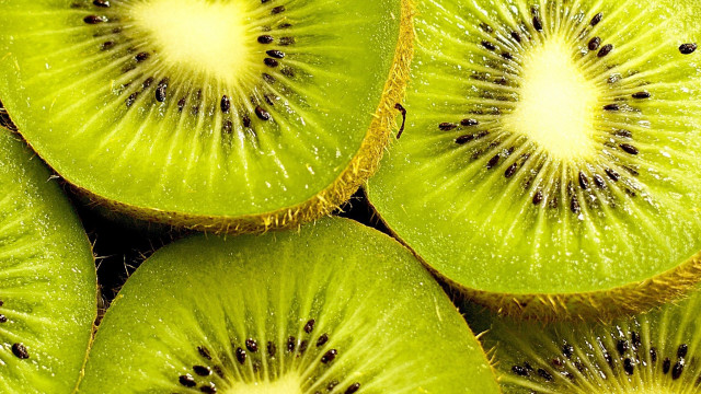 Kiwi slices closeup stacked bite free wallpaper for desktop - medium preview image