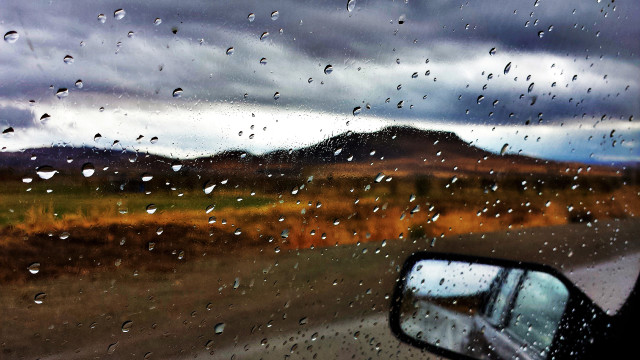 Rain covered windshield mountain range free wallpaper for desktop - medium preview image